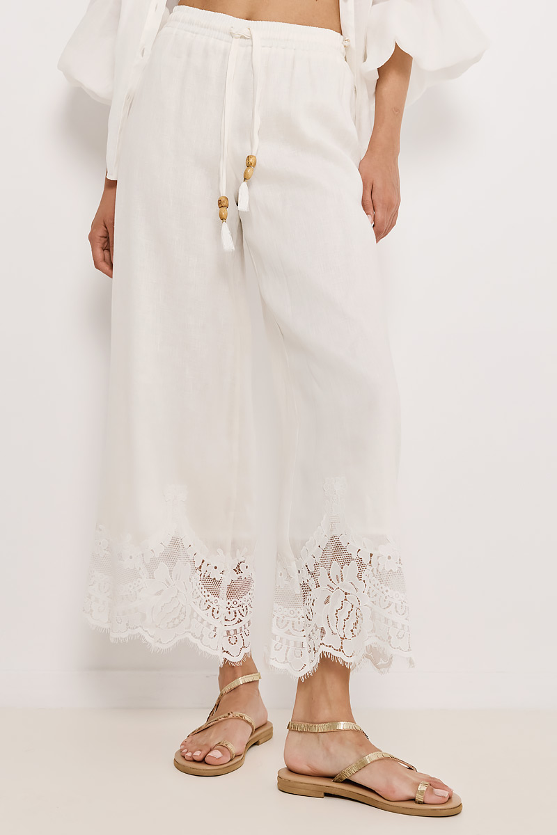 PANTS WITH ELASTIC WAISTBAND AND EMBROIDERY AT THE HEM